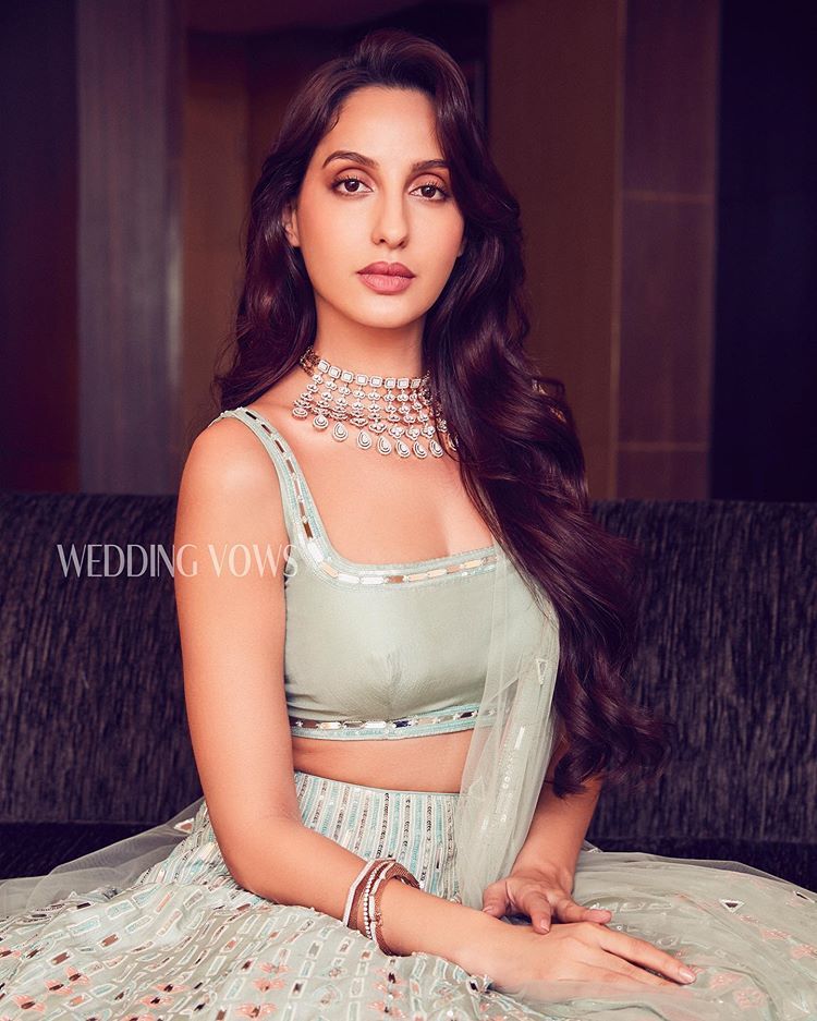 nora fatehi poses hot bikini